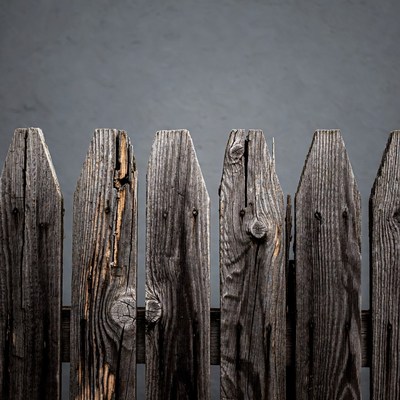 Wooden fence with weathered planks