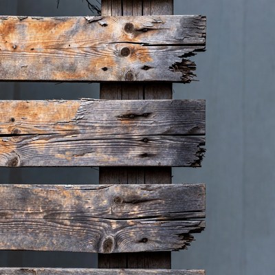 Weathered wood against gray wall