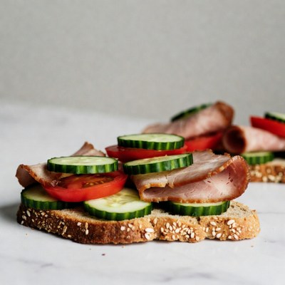 Sliced meat and vegetable sandwich on bread