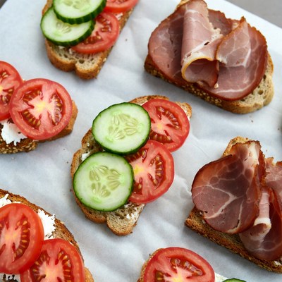 Open sandwiches with toppings on a table
