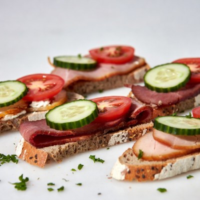 Sandwiches with meat and vegetables on bread