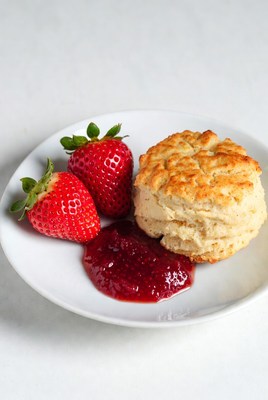 Fresh biscuit with strawberries and jam
