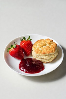 Fresh strawberries with biscuit and jam