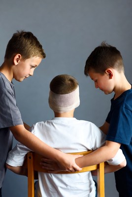 Boys help friend with head injury