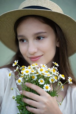 Young girl with flowers in hand