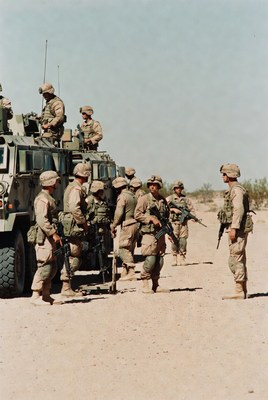 Military personnel in desert setting