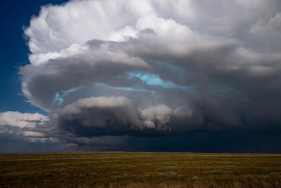 Dramatic storm clouds over open field