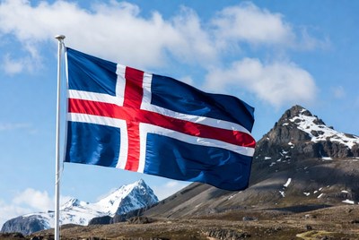 Iceland flag waving near mountains