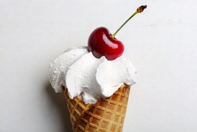 Ice cream cone with cherry on top