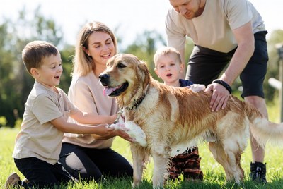 Family enjoying time with a dog
