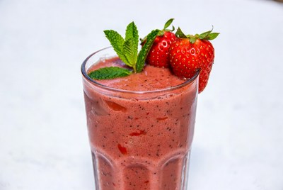 Fresh strawberry smoothie with mint garnish