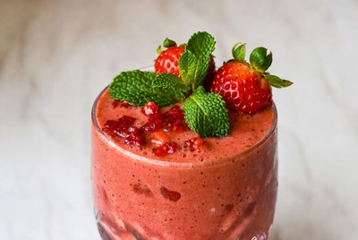 Fresh strawberry smoothie with mint garnish