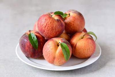 Fresh peaches on a plate