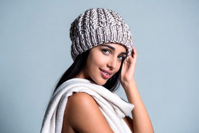 Woman in knitted hat and scarf