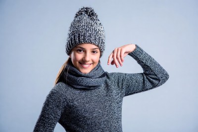 Girl wearing winter clothes and smiling