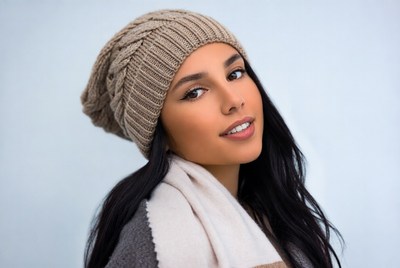 Woman in winter hat poses for camera