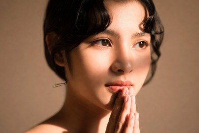 Woman with hands in prayer position