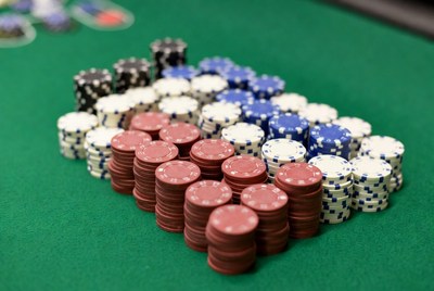 Stack of poker chips on a green table