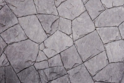Cracked stone surface in gray shades
