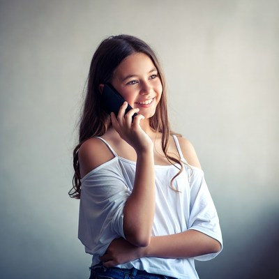 Girl talking on the phone indoors
