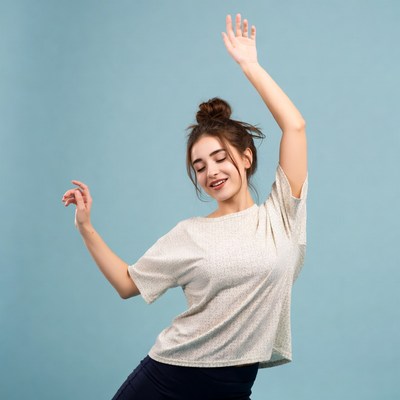 Dancer moving against blue background
