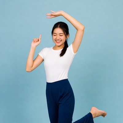 Joyful dance in blue studio setting
