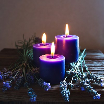 Candles with lavender on wood