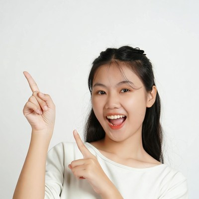 Young girl pointing with a smile