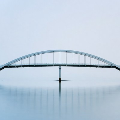Bridge over calm water at dawn