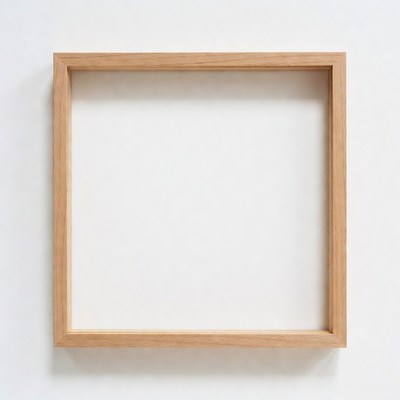 Empty wooden frame on white wall