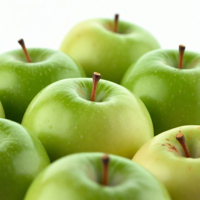 Green apples arranged on white background