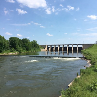 River with dam and green banks