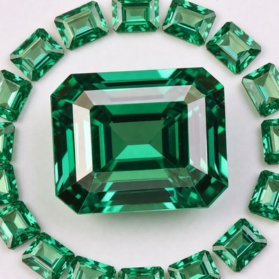 Green gemstones arranged on a surface