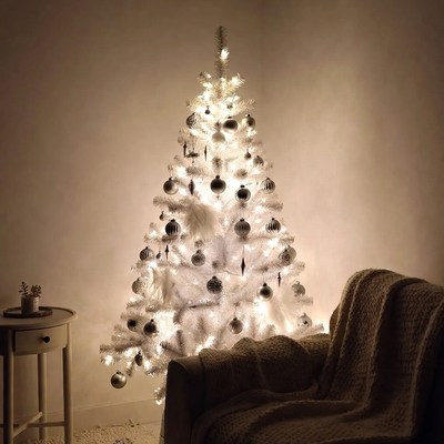 Bright white christmas tree in cozy room