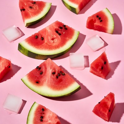 Watermelon slices on pink surface