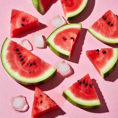 Watermelon slices on pink surface