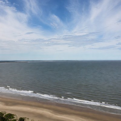 Waves meeting sand at the beach