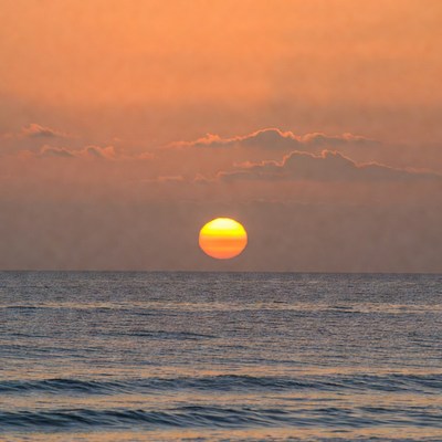 Sunset over calm ocean waters