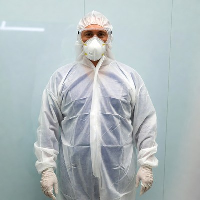 Person in protective suit indoors
