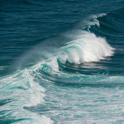 Waves crashing on sandy shore