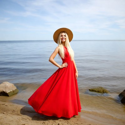 Woman in red dress by the water