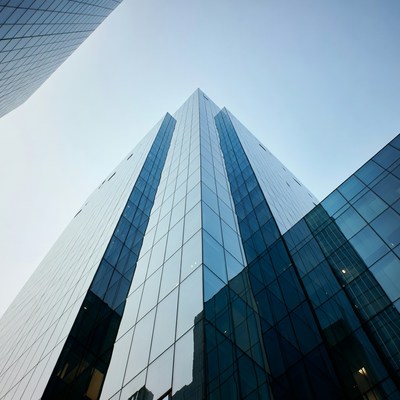 Tall buildings reaching blue sky
