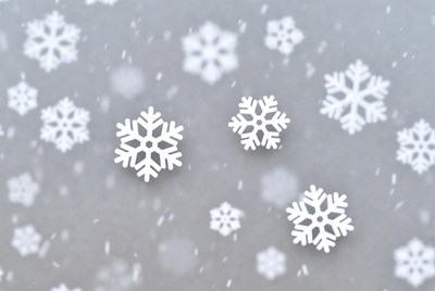 Snowflakes falling on gray background