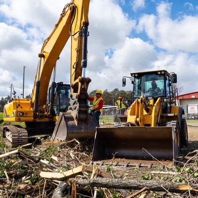 Heavy machinery clearing debris on site