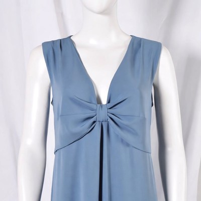 Dress displayed on mannequin with bow detail