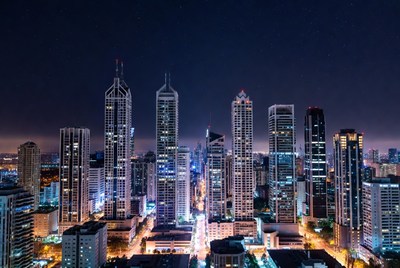 City skyline at night with bright lights