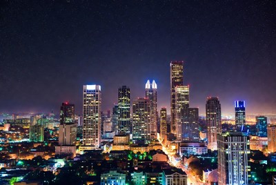 City skyline at night with lights shining