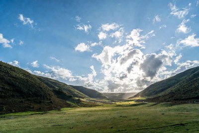Clouds over valley plain