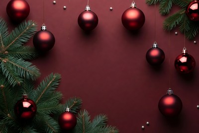 Red ornaments with green pine branches