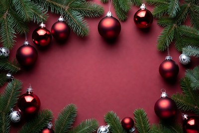 Festive red ornaments and pine branches